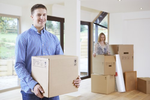 Moving team preparing household items for transport