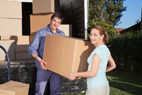 Charity donation items and recyclable materials arranged after a move